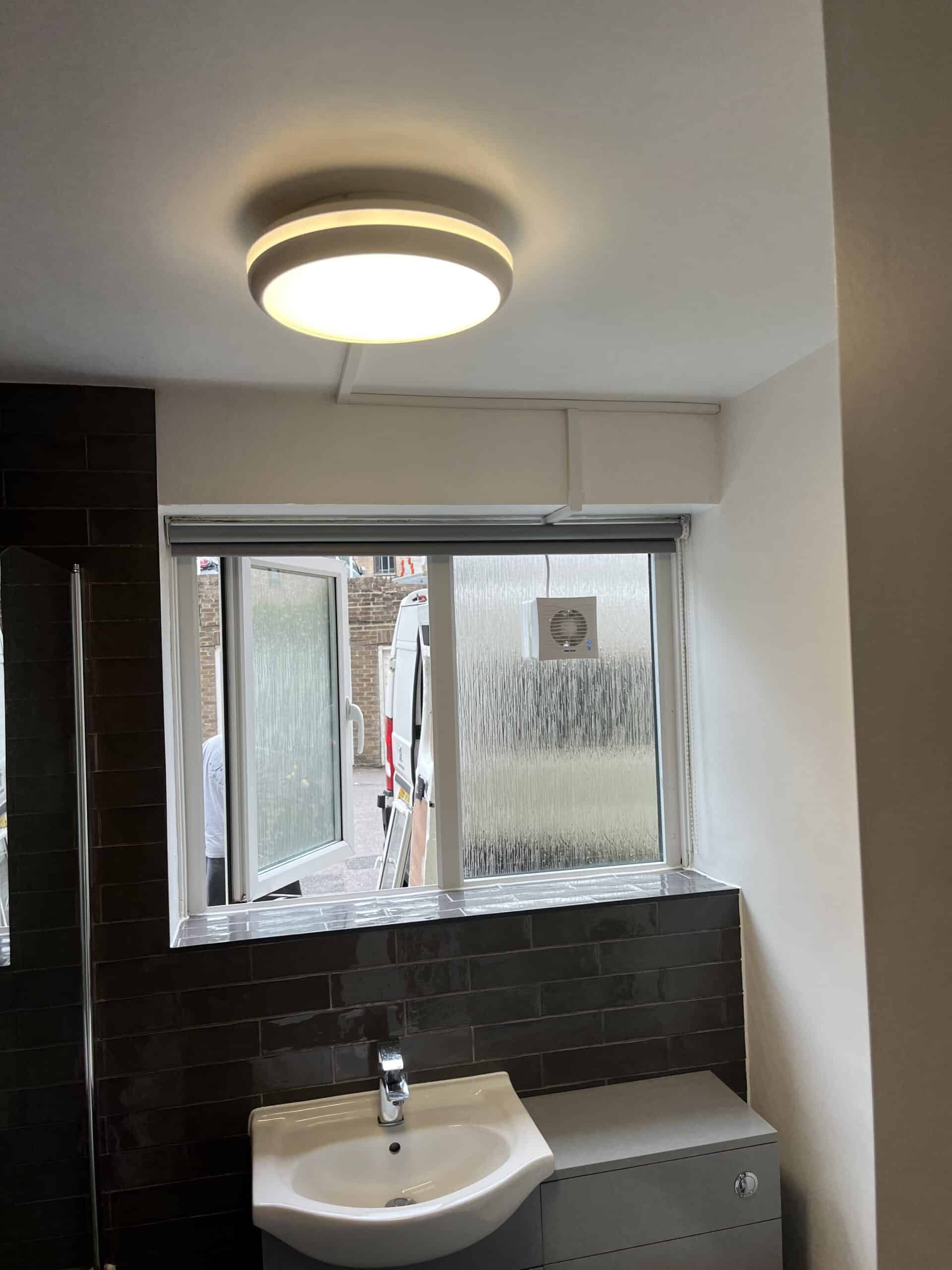 Replacement bathroom light and extractor fan installed at Wick Hall in Brighton